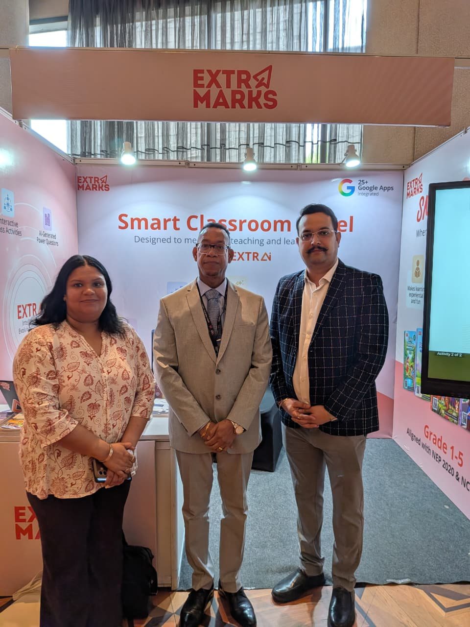 Extramarks team at the booth with the Smart Classroom Panel at WES Delhi 2026