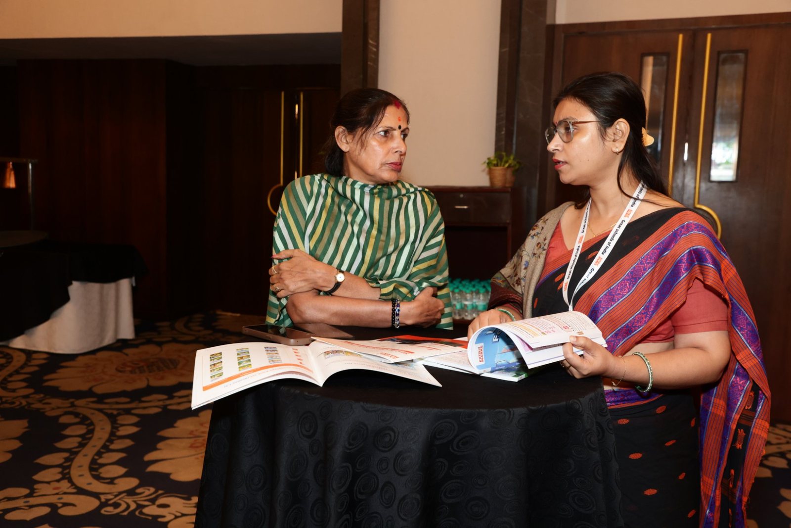 Great Schools of India Summit 2026: Dehradun Brings Together 50+ School Leaders 21 School leaders reading Extramarks brochures at the Great Schools of India Summit 2026, Dehradun