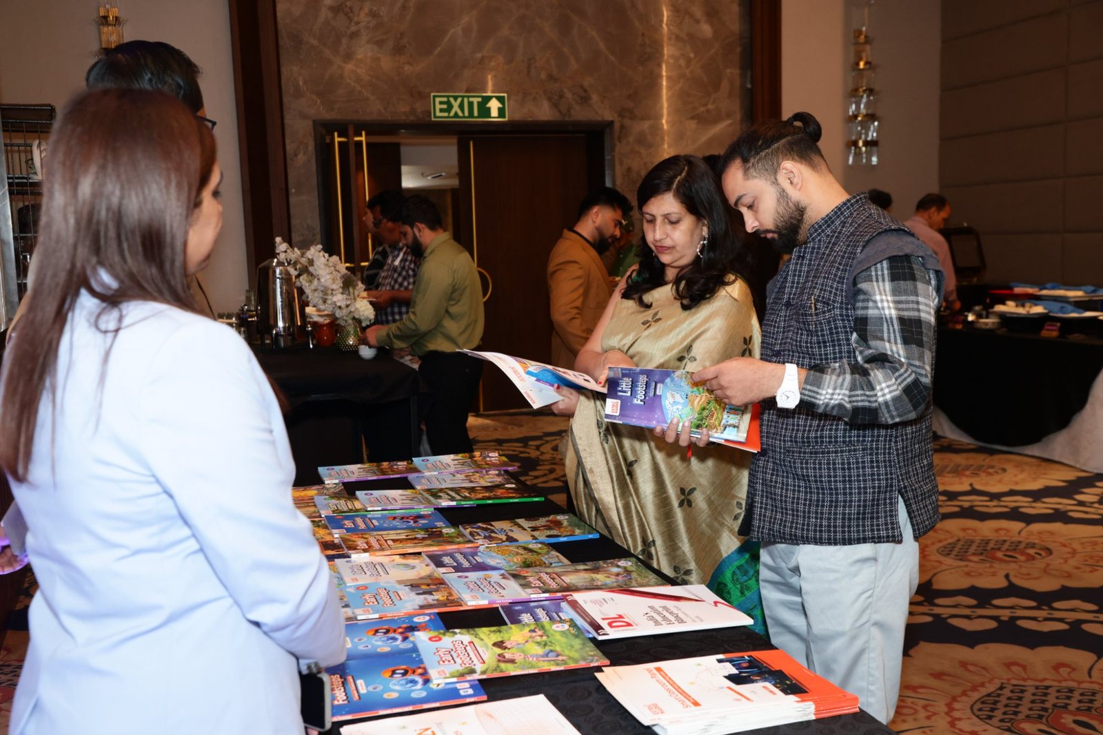 Great Schools of India Summit 2026: Dehradun Brings Together 50+ School Leaders 20 Educators looking at Extramarks Smart Books at the Great Schools of India Summit 2026, Dehradun